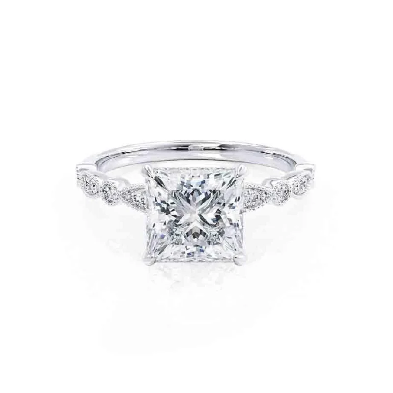 Cushion - cut diamond engagement ring with a halo of moissanite in a silver - plated bandHOPE - Princess Moissanite & Diamond Platinum Vintage Shoulder Set