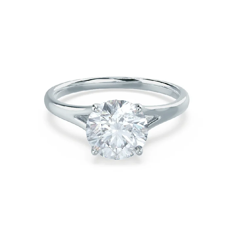 Round - cut diamond engagement ring with a twisted band design in 14K white goldDAHLIA - Round Moissanite 9k White Gold Split Shank Solitaire Ring