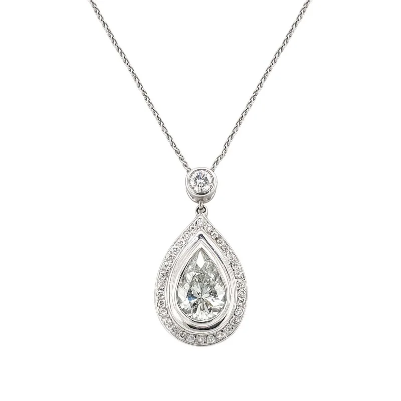 Cushion - cut diamond engagement ring with a halo of moissanite in a silver - plated bandPear Shaped Bezel Set Diamond Halo Pendant Necklace in White Gold, 0.50 cttw