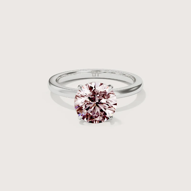 Cushion - cut diamond engagement ring with a halo of moissanite in a silver - plated bandBianca Round Solitaire Pink Diamond - Hidden Halo