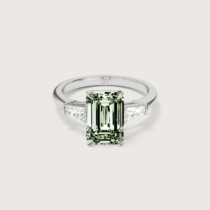 Three - stone diamond engagement ring in rose gold, symbolizing past, present, and futureMayfair Emerald Baguette Trilogy Green Diamond