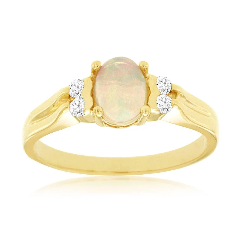 Solitaire diamond engagement ring with a platinum setting for a classic and elegant lookYellow Tone Oval Cabochon Ethiopian Opal and Diamond Ring in Yellow Gold