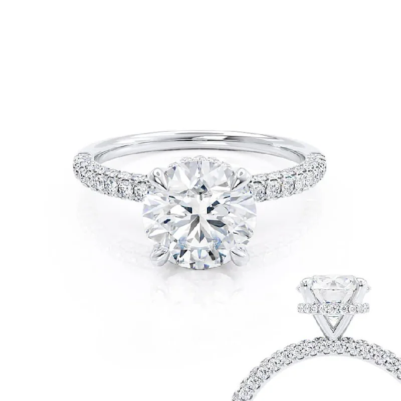 Halo diamond engagement ring in 18K white gold with a center oval - cut stoneCOCO - Round Moissanite & Diamond Platinum Petite Hidden Halo Triple Pavé Shoulder Set Ring