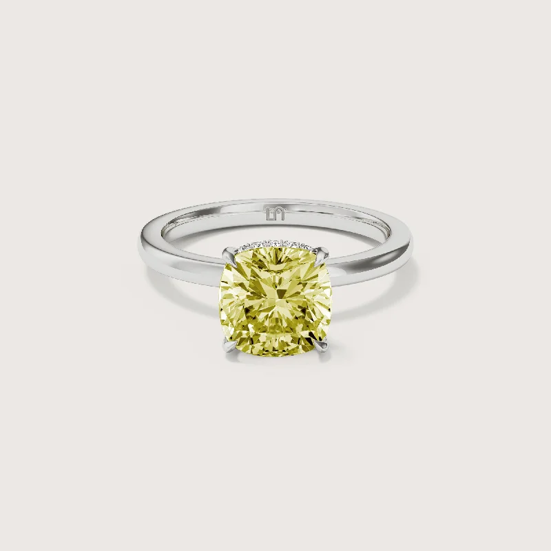 Solitaire diamond engagement ring with a platinum setting for a classic and elegant lookBianca Cushion Solitaire Yellow Diamond - Hidden Halo