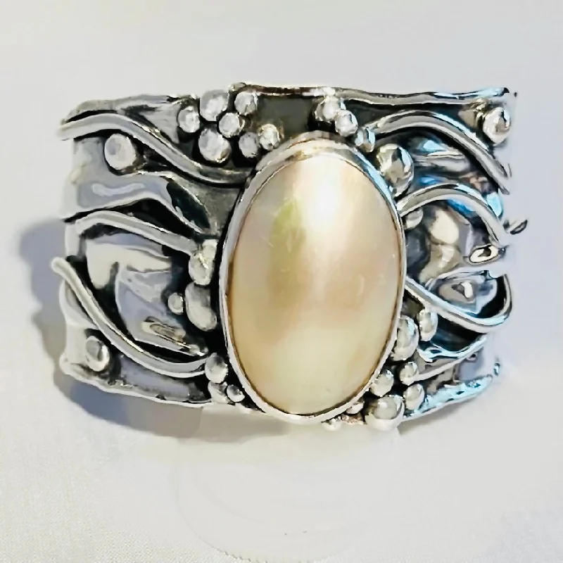 Vintage - Inspired Women's Cuff Bracelets with Filigree Work for a Retro AppealMabe Pearl in Sterling Silver Cuff Bracelet.