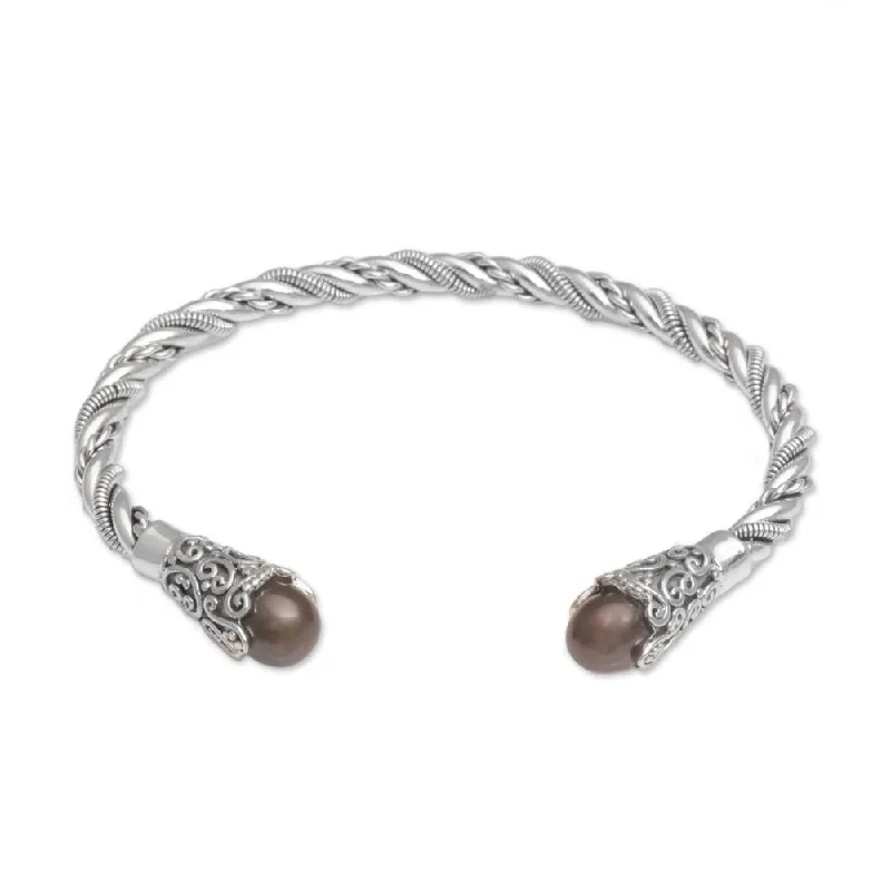 Pearl and Crystal - Embellished Bracelet with Rhinestone - Studded Clasp for a Glamorous Party LookHandmade Sterling Silver 'Jepun Seeds in Brown' Cultured Pearl Cuff Bracelet (Indonesia)