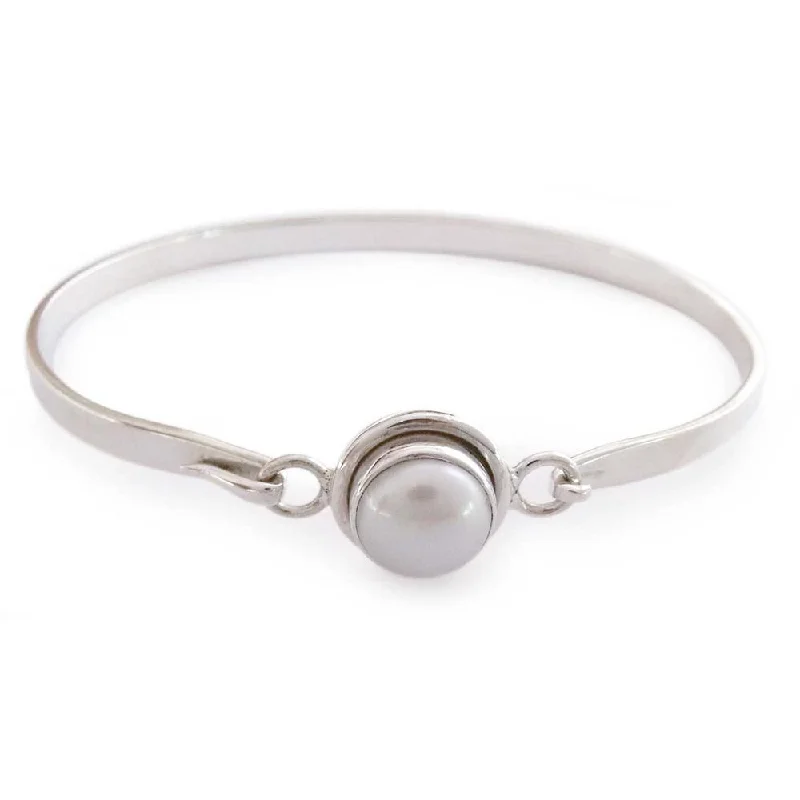 Beach - Inspired Pearl and Shell Bracelet with Seashell - Shaped Beads for a Summery LookHandmade Sterling Silver Aesthetic Moon Pearl Bangle (India)