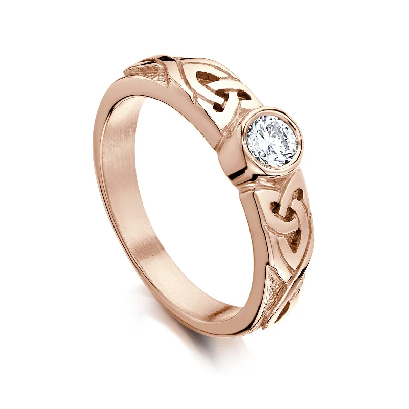 Oval Cut Engagement Rings in Palladium with a Hidden Halo for a Surprise SparkleCeltic Knotwork Diamond Solitaire Ring in 9ct Rose Gold