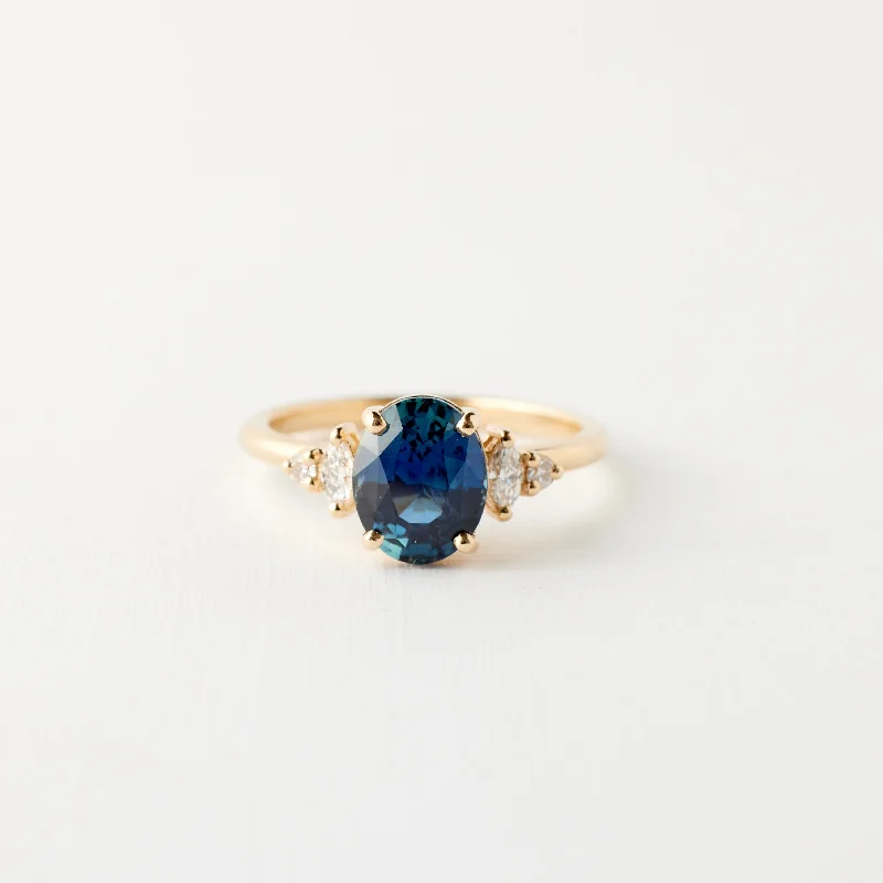 Pear - Shaped Engagement Rings in Yellow Gold with a Diamond - Encrusted BandDesi Ring - 2.12 Carat Teal Blue Oval Sapphire