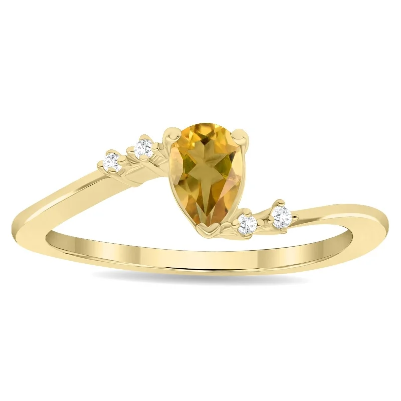 Malachite Gemstone Rings in 14K Gold with a Carved Stone for a Unique and Artistic AppealWomen's Pear Shaped Citrine and Diamond Wave Ring in 10K Yellow Gold