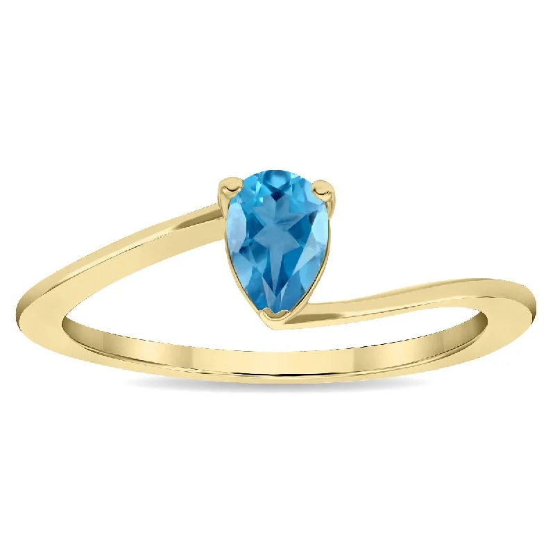 Ruby Gemstone Rings in 14K Yellow Gold with a Solitaire Setting for a Classic and Bold StatementWomen's Solitaire Pear Shaped Blue Topaz Wave Ring in 10K Yellow Gold